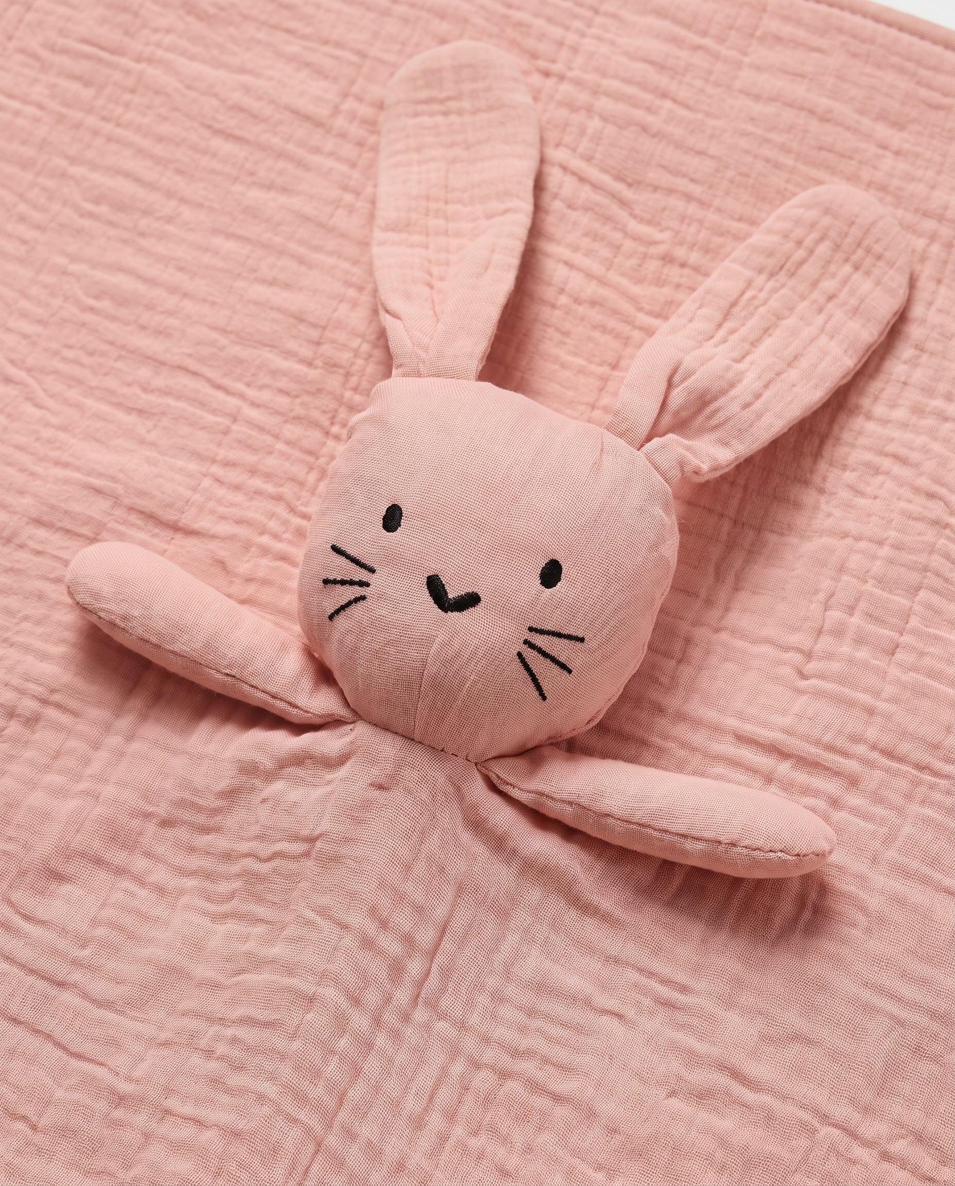 doudou lapin visage brodé détail amande corail la câline